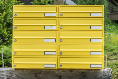 Yellow letterbox made of tin without a name in a rural area, Austriaの写真素材