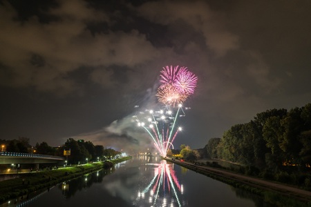 Fireworks of the Herbstdult with ferris wheel and cathedral in Regensburg, Germanyの写真素材