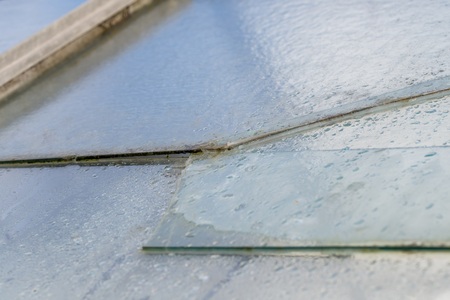 Broken glass pane of a greenhouse, Germany