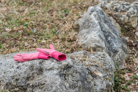 Left lying child on a stone in a parkの写真素材