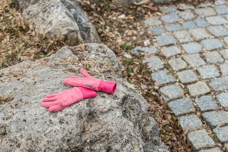Left lying child on a stone in a parkの写真素材