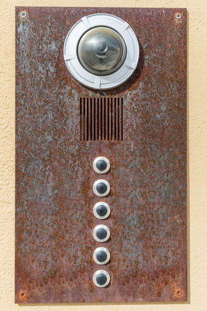 Old rusty house bell with camera and intercom, Germany