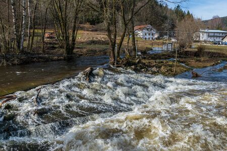 Grafenau, Bavaria, Germany, March 17, 2019, The river Grosse Ohe in Grafenau at high water in spring, Germanyのeditorial素材
