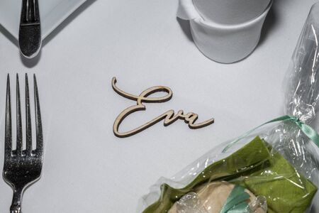 Glass table with a cutlery and the name Eva, Germany