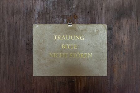 Regensburg, Bavaria, Germany, April 27, 2019, Sign to the registry office in the old town hall in Regensburg with the German text - Wedding ceremony please do not disturb, Germanyのeditorial素材