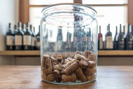 Regensburg, Bavaria, Germany, April 27, 2019, Many wine corks of different wines in a large glass of champagne coolerのeditorial素材