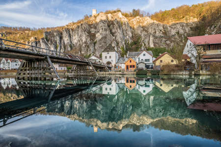 View of Essing market in AltmÃ¼hl valley with the bridge over the river and the castle on the rock, Germanyのeditorial素材