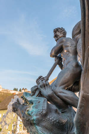 Burglengenfeld, Bavaria, Germany, March 28, 2021, City fountain Georgsbrunnen - Nackerte Schore - called dragon slayer Georg and dragon after the design of Professor JÃ¼rgen Weber fountain on the Markeのeditorial素材