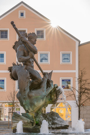 Burglengenfeld, Bavaria, Germany, March 28, 2021, City fountain Georgsbrunnen - Nackerte Schore - called dragon slayer Georg and dragon after the design of Professor JÃ¼rgen Weber fountain on the Markeのeditorial素材