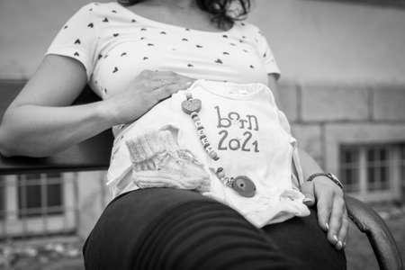 Creative baby bump photo shoot with pregnant mother and fatherの写真素材