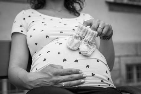 Creative baby bump photo shoot with pregnant mother and father