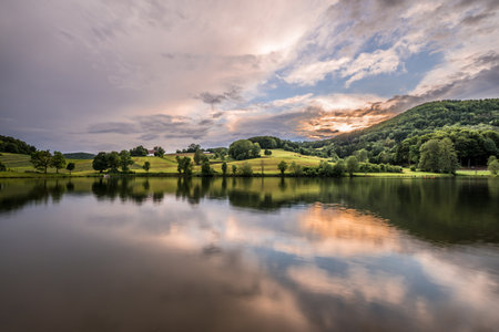 Image of landscape in Bavarian forest of Ebenreuth See during sunset, Germanyの写真素材