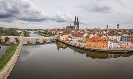 Regensburg, Bavaria, Germany, May 05, 2022: Panorama of Regensburg city in Bavaria with the river Danube the cathedral and the stone bridge in summer with cloudy skyのeditorial素材