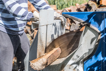 Close up of circular saw with logs for wood cutting, Germanyの写真素材