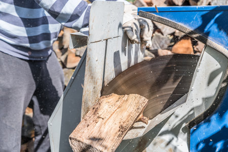 Close up of circular saw with logs for wood cutting, Germanyの写真素材