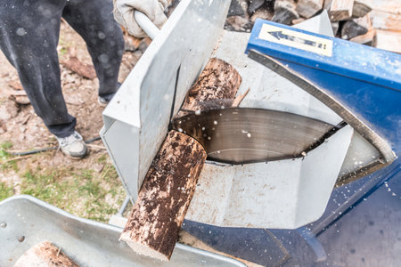 Close up of circular saw with logs for wood cutting, Germanyの写真素材