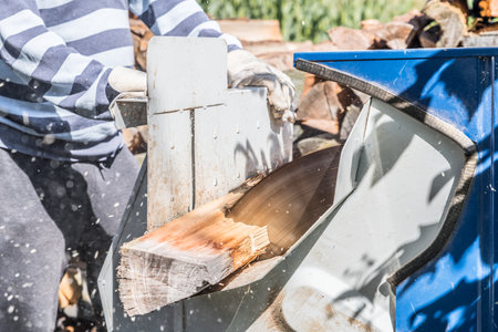 Close up of circular saw with logs for wood cutting, Germanyの写真素材