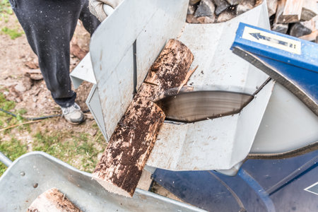 Close up of circular saw with logs for wood cutting, Germanyの写真素材