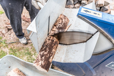 Close up of circular saw with logs for wood cutting, Germanyの写真素材