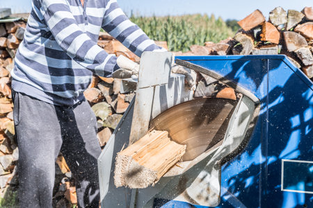 Close up of circular saw with logs for wood cutting, Germanyの写真素材