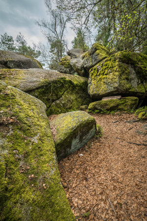 From outside of the Stone church in Thurmansbang - Old church built in a stone cave between erratic rocks and large stones in the Bavarian Forest, Germanyの写真素材