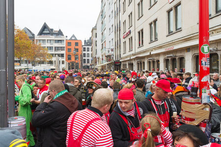 Start of Carneval in Cologne at 11.11.2014 on Heumarkt with crowd in costumesのeditorial素材