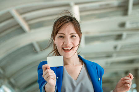 Beautiful girls with shopping bags are smiling while doing shopping in the mallの写真素材
