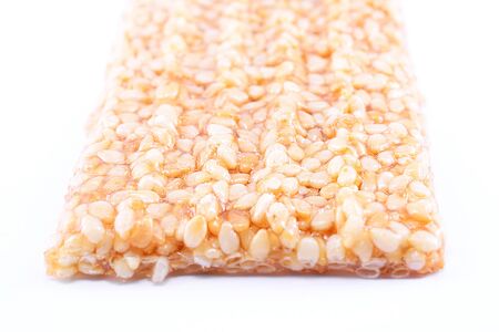 Honey bars with sesame snack on a white backgroundの写真素材