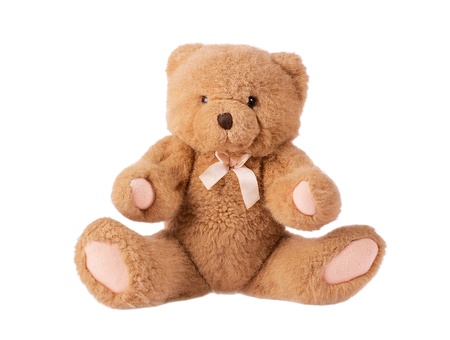 Classic teddy bear with pink bow isolated on white background の写真素材
