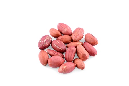Heap processed peanuts isolated on white background の写真素材