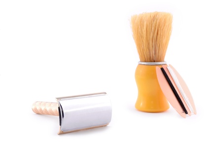 Elegant old brush for shaving, near an old razorの写真素材