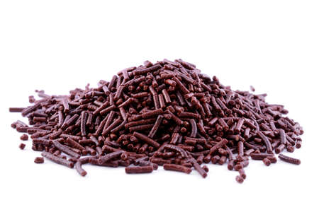 Heap grated chocolate isolated on a white backgroundの写真素材
