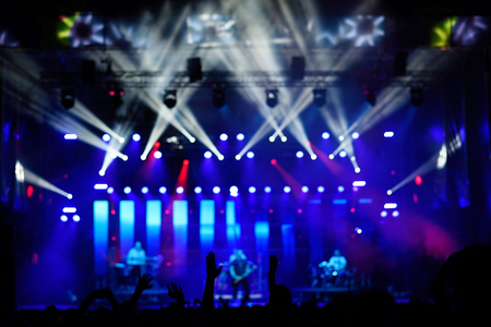 Blurred photo of concert crowd in front of bright stage lights, detailの写真素材
