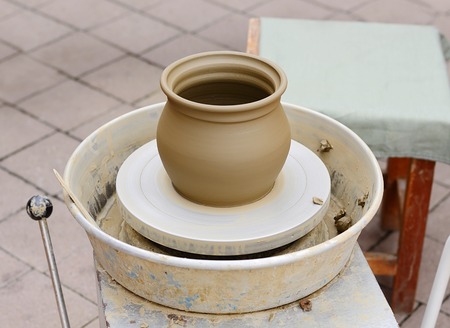 Jar of white clay on potter systemの写真素材