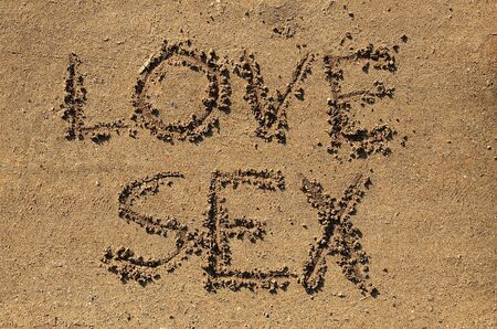 Love sex text in the sandの写真素材
