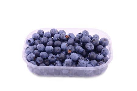 More blueberry in a plastic bowl isolated on white backgroundの写真素材