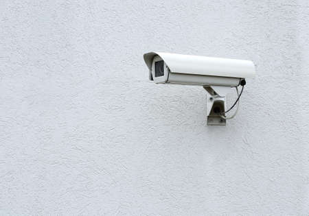 CCTV security camera on a gray the wallの写真素材