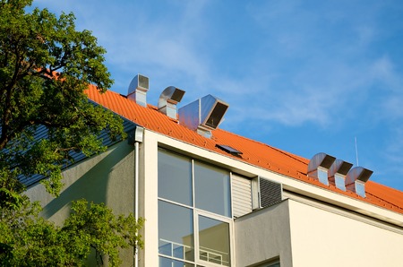 Industrial air conditioner fan on the roofの写真素材