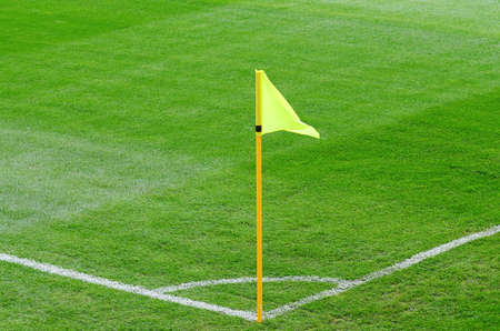 Yellow corner flag on an soccer field