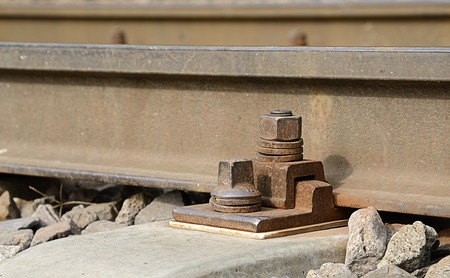 Closeup photo of rusty fasteners on railway railの写真素材