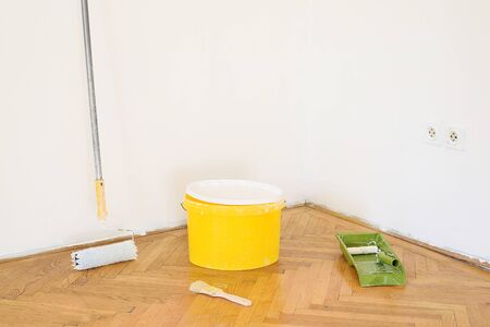 Used home decorating tools on the floorの写真素材