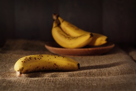 Ripe banana on a sackcloth. Banana stil lifeの写真素材