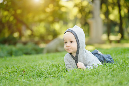 Adorable baby boy playing in the parkの写真素材