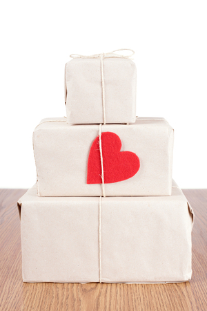 Red heart shape on package a wooden tableの写真素材