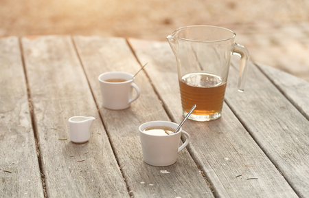 Vintage photo of a tea cup on the wooden tableの写真素材