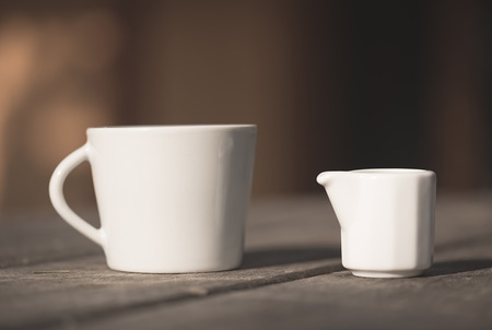 Vintage photo of a tea cup on the wooden tableの写真素材