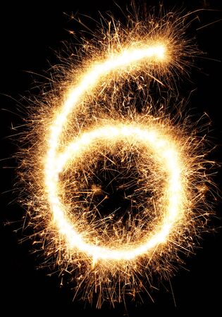 Sparkler firework light number 6 isolated on black backgroundの写真素材