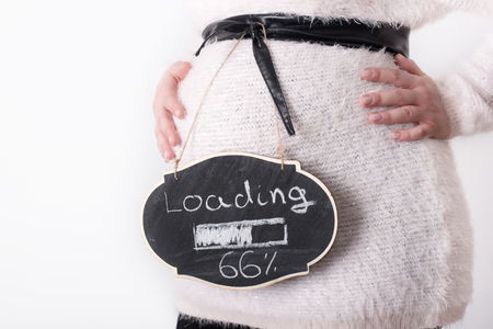 Photo of pregnant woman touching her belly with handsの写真素材