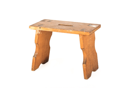 Used wooden stool isolated on a white backgroundの写真素材