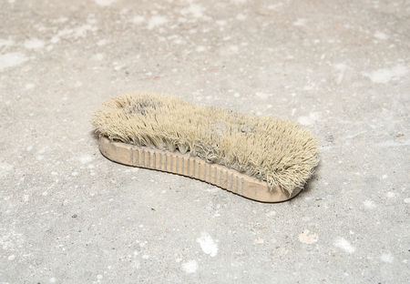 Cleaning brush tool on the floor. Closeup photo の写真素材